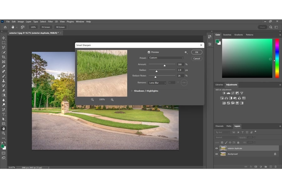 Adjusting the settings for the Smart Sharpen tool to edit an image of a house with a manicured lawn