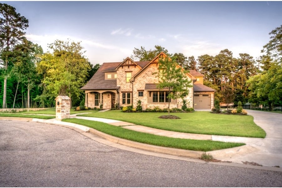 A sharpened image of a house with a manicured lawn