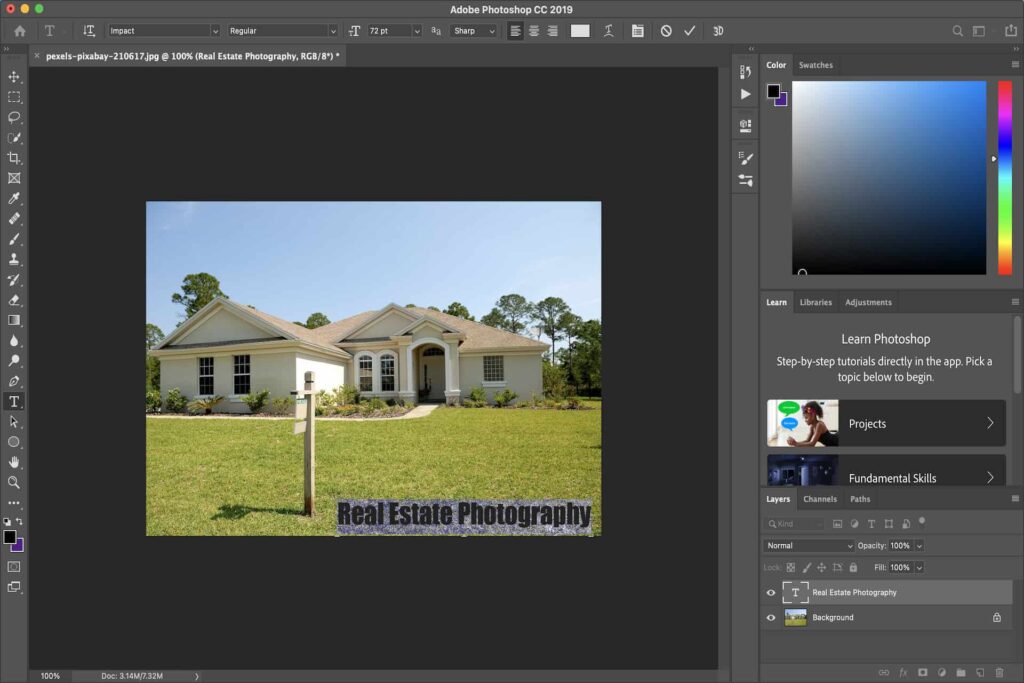 A highlighted text placed on an image of a cream bungalow house being edited in Photoshop