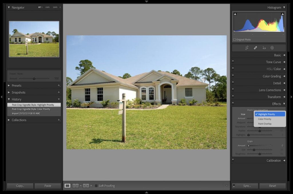 Editing an image of a white house with a brown roof and surrounded by green grass using Vignette in Lightroom