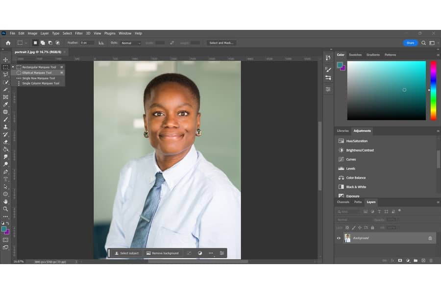 Making the eyes in an image of a person wearing a white button shirt, blue necktie, and round earrings glow using Photoshop