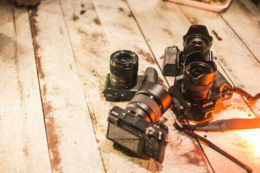 Sony camera models on a wooden surface