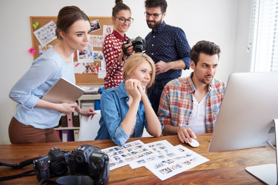 A group of photographers in an office room