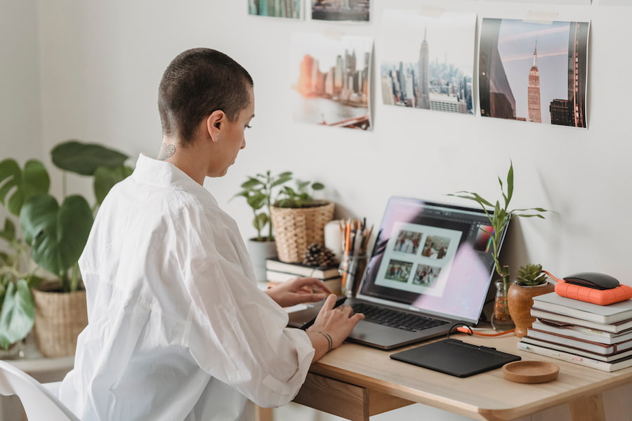 Woman editing photos on her laptop