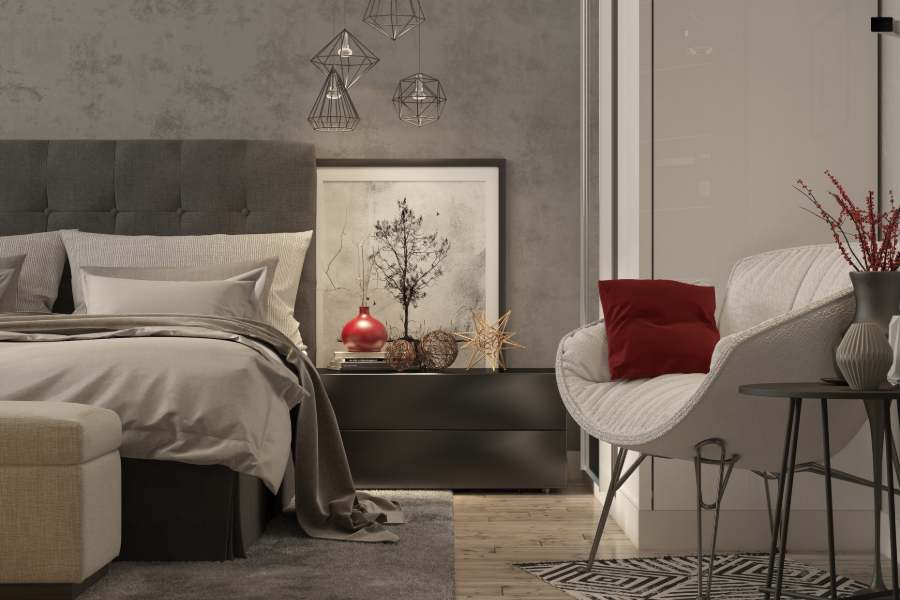 Bedroom with gray interior motif with a touch of red accent colors